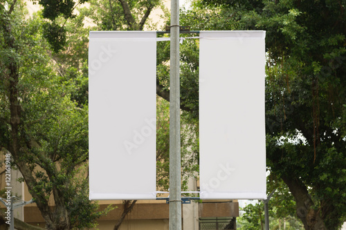 Large blank billboard on a street wall, banners with room to add your own text