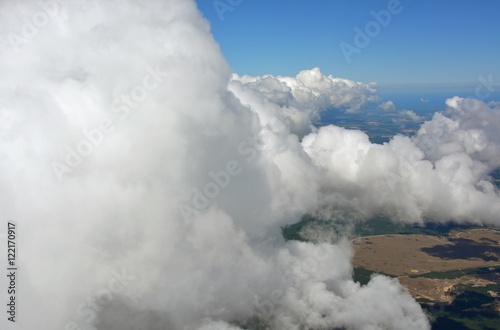 view into the horizon as the aircraft flies through the clouds, near the Georgian Bay, Ontario Canada 