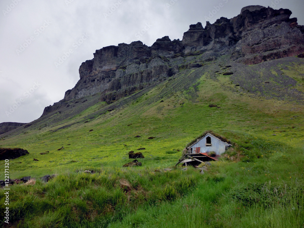 Abandoned shack built into Icelandic hillside