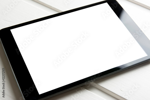 generic tablet pc on top of wooden table