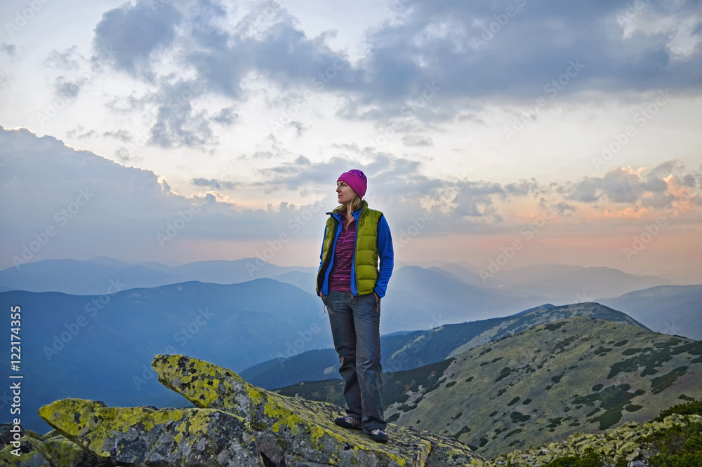 Smiling young woman   on  the  top of   mount Great Sivulja  ,Carpathian ,Ukraine