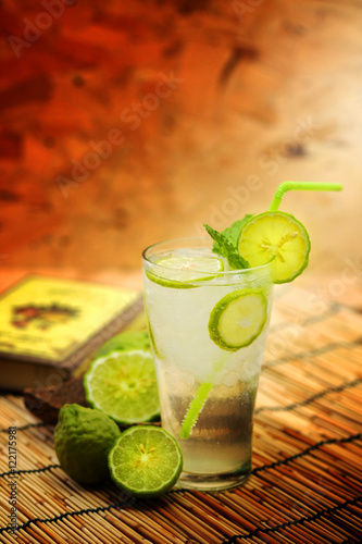 Kaffir lime, Bergamot soda Cool drink , Herb for Treatment of Acid Reflux, with Earth tone background