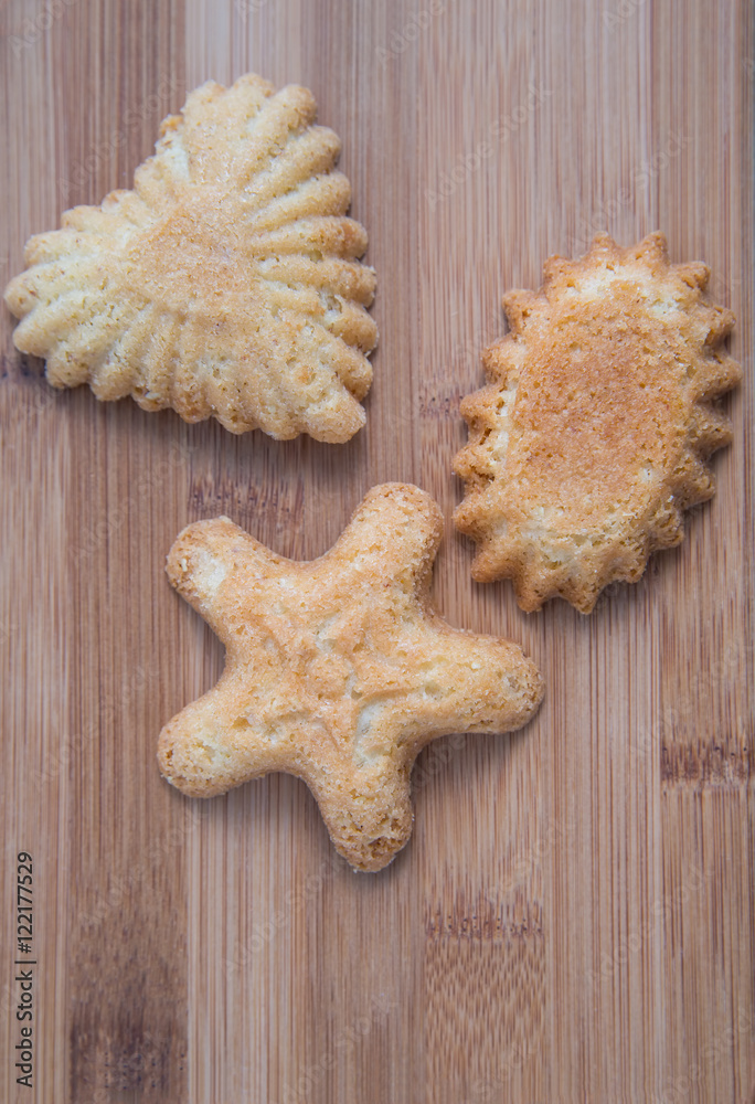 Sandbakkel cookies on a bamboo wooden cutting board Sandbakkel cookies on a bamboo wooden cutting board