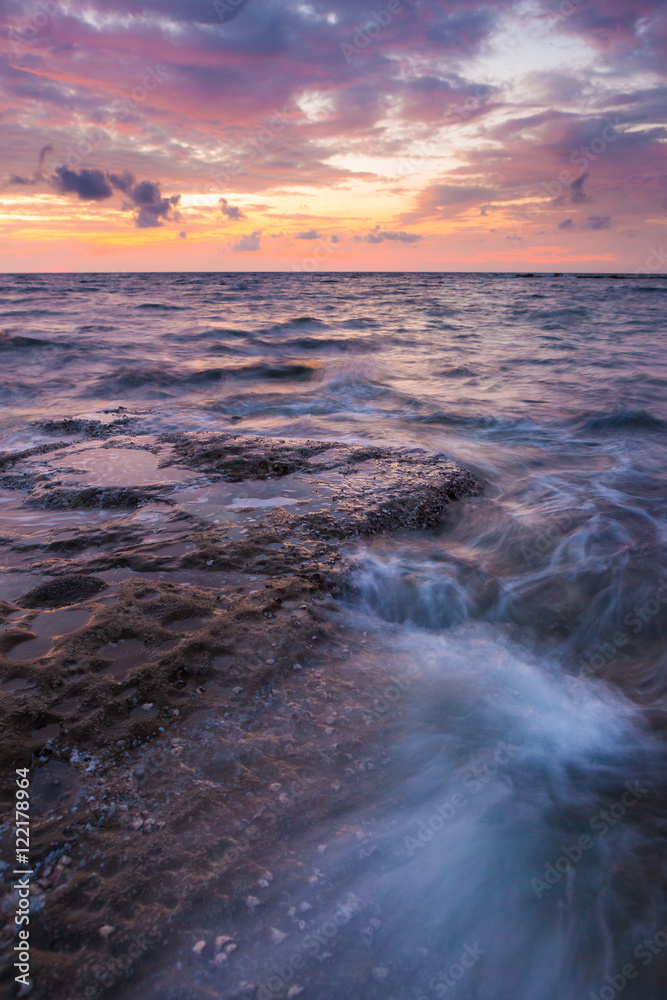 Long exposure sea and rocks at twilight Long exposure sea and rocks at twilight