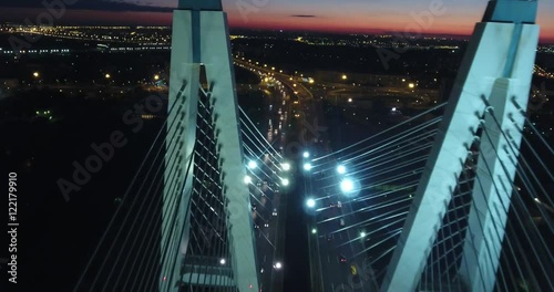 Cinematic aerial night view of Obuhovskiy bridge with the illuminated light from cars, Saint Petersburg, Russian Federation