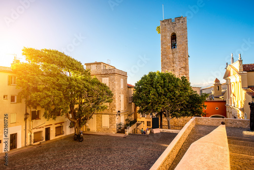 Central square with tower and church in Antibes coastal village on the french riviera in France photo