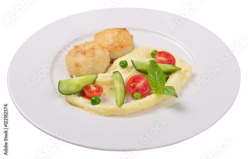 mashed potatoes with meatballs and vegetables, isolated.