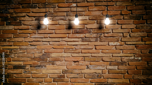 Fototapeta Naklejka Na Ścianę i Meble -  Light bulbs on brick wall background. 3d illustration