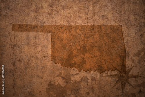 oklahoma state map on a old vintage crack paper background