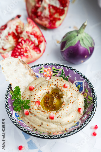 Arabic food baba ghanoush close-up on the plate and ingredients  the table. vertical