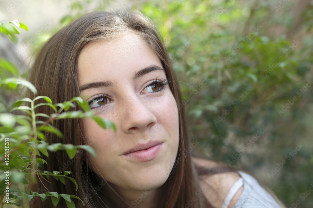 Face of a girl among branches of a tree Face of a girl among branches of a tree
