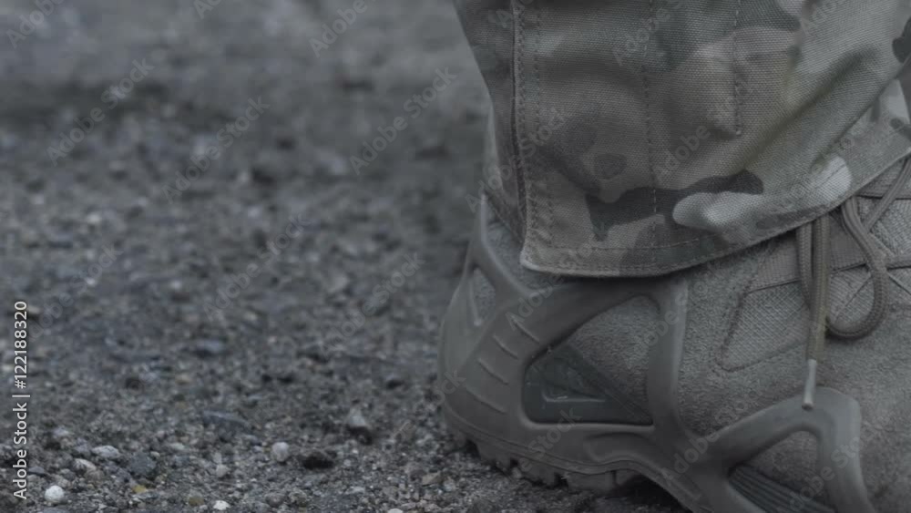 The military in army boots on the ground.