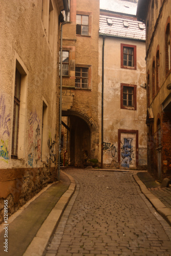 Fototapeta Naklejka Na Ścianę i Meble -  A street and graffiti in Halle, Germany