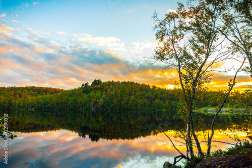 Picturesque autumn landscape.Bright sunset on forest lake in autumn