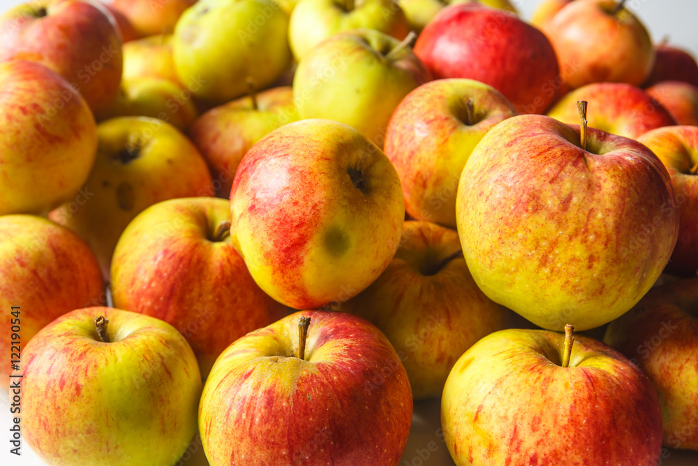 Green and red organic apples are on the table. Green and red organic apples are on the table.