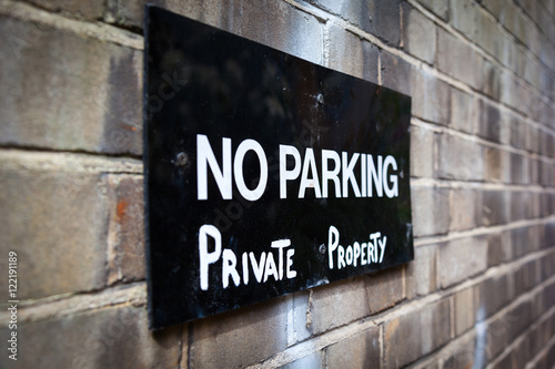 The plate on a wall "The parking is prohibited, a private property". London, Great Britain
