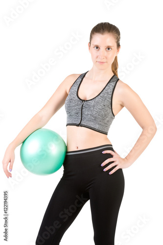 Fit Woman Standing Holding a Pilates Ball
