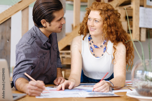 Two young architects in office