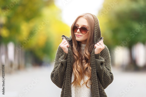 Portrait of a beautiful female model in autmn clothes outdoor. sensetive look.close up. Autumn fashin concept. photo