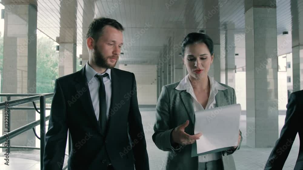 Portrait of group of confident and successful business people discussing their projects Portrait of group of confident and successful business people discussing their projects