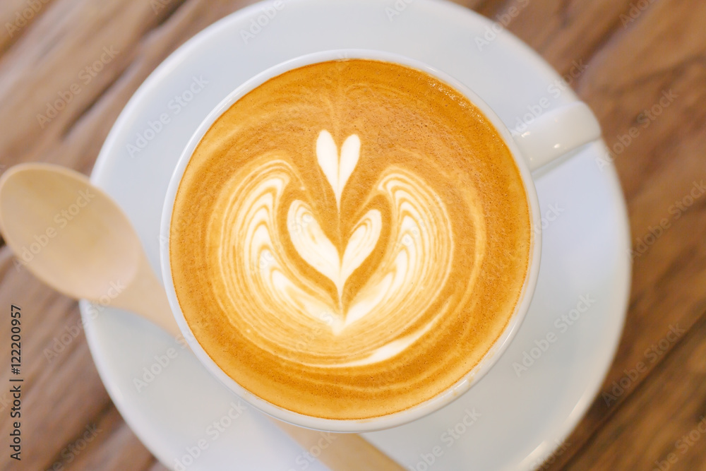 Cup of coffee latte art on wood table