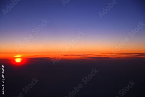 sunrise from horizon seen from air plane in the sky © nd700