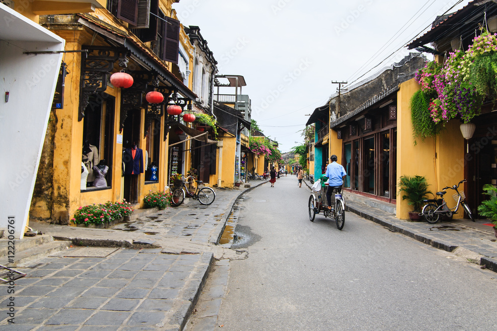 Cyclo in Hoi An Ancient Town, Quang Nam, Vietnam. Hoi An is recognized as a World Heritage Site by UNESCO.
