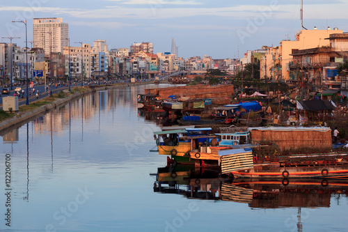 Binh Dong flower market during the Tet Holiday (Lunar New Year), Ho Chi Minh city, Vietnam. Flowers vendors bring the plants to the city by boats, and park them line by line at the Tau Hu canal.