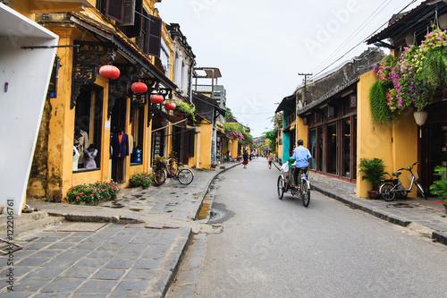 Cyclo in Hoi An Ancient Town, Quang Nam, Vietnam. Hoi An is recognized as a World Heritage Site by UNESCO.