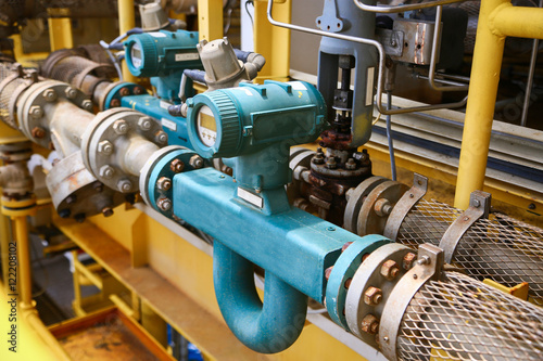 Flow transmitter or Flow transducer equipment function and sent PLC logic to processor in oil and gas production process,Electronic device in oil and gas industry and equipment under maintenance mode. photo