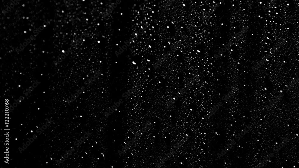 An extreme close up of water on black background.