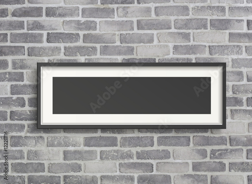 blank frame on grey birck wall