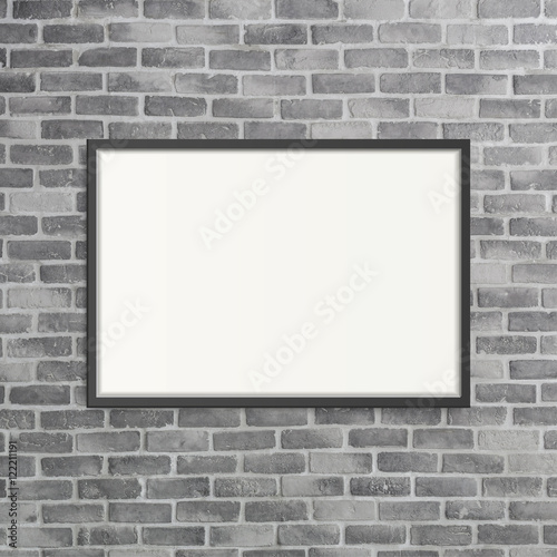 blank frame on grey birck wall