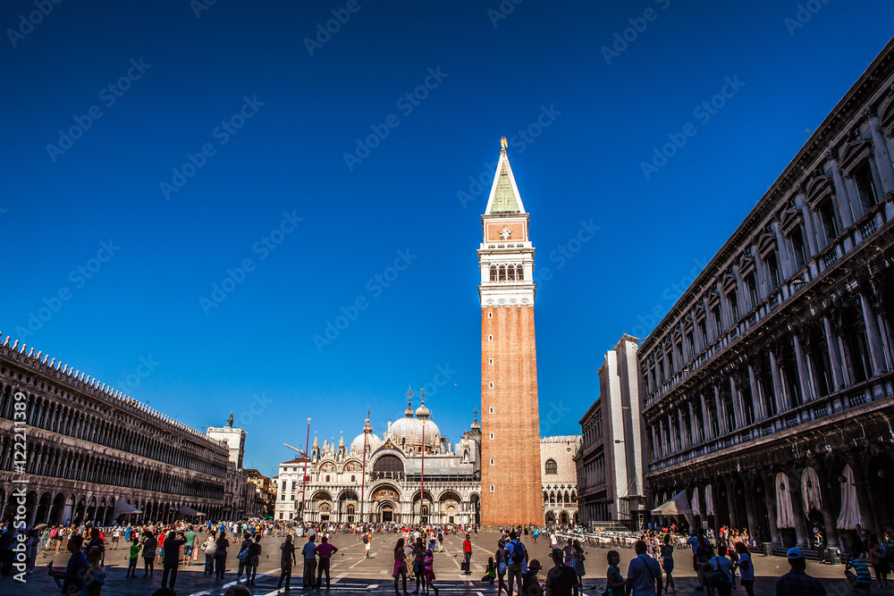 VENICE, ITALY - AUGUST 18, 2016: Piazza San Marco with the Basilica of Saint Mark and the bell tower of St Mark's Campanile (Campanile di San Marco) close-up on August 18, 2016 in Venice, Italy.