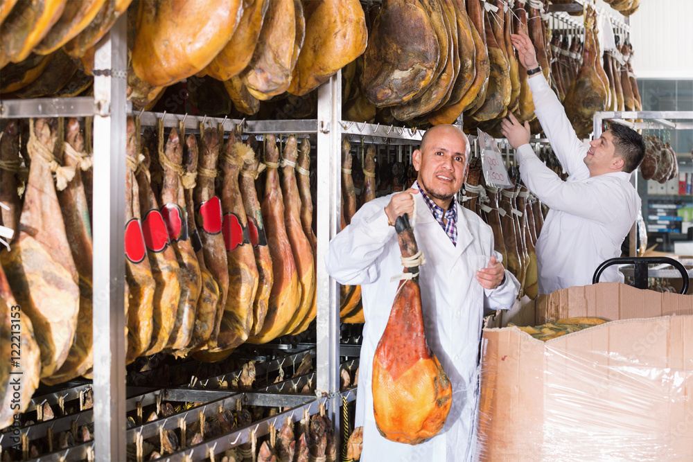 Ordinary  technologists checking joints of iberico jamon
