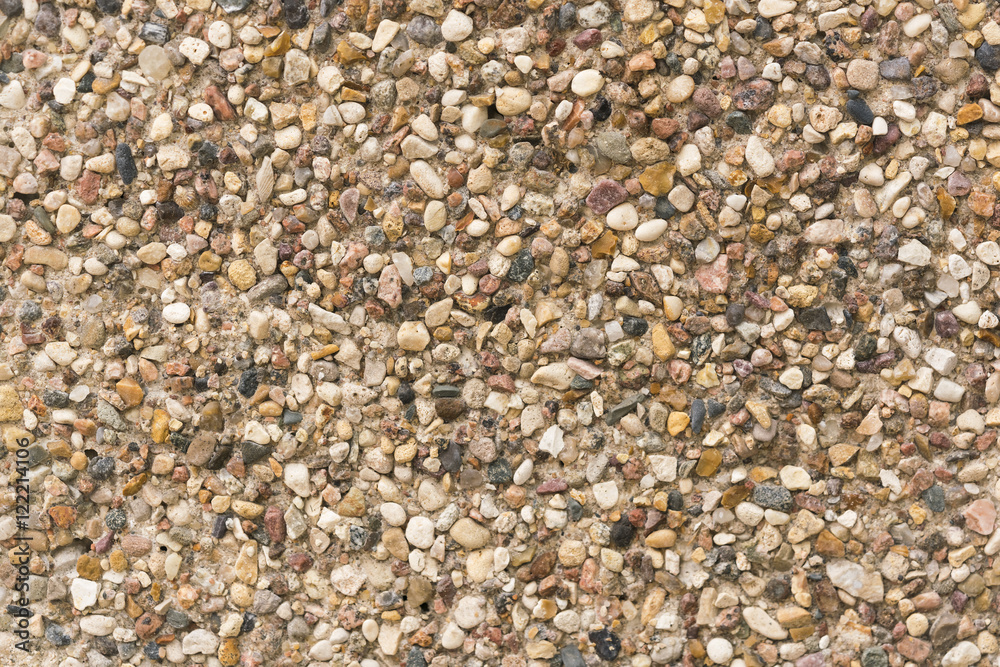 Brown stone wall of pebbles, background, texture Brown stone wall of pebbles, background, texture