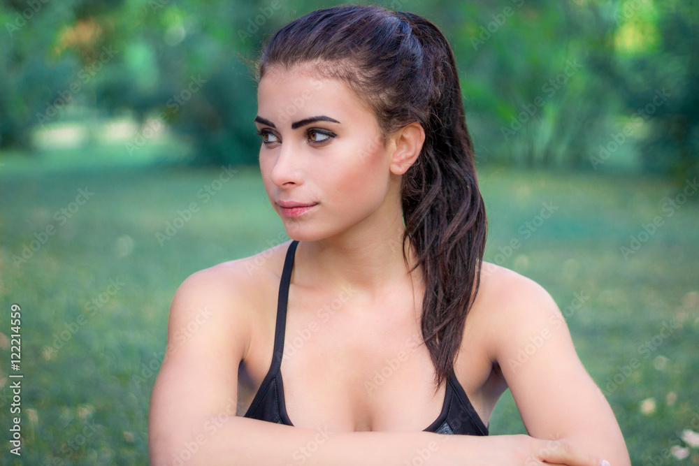 Young fitness girl rests during training workout Young fitness girl rests during training workout