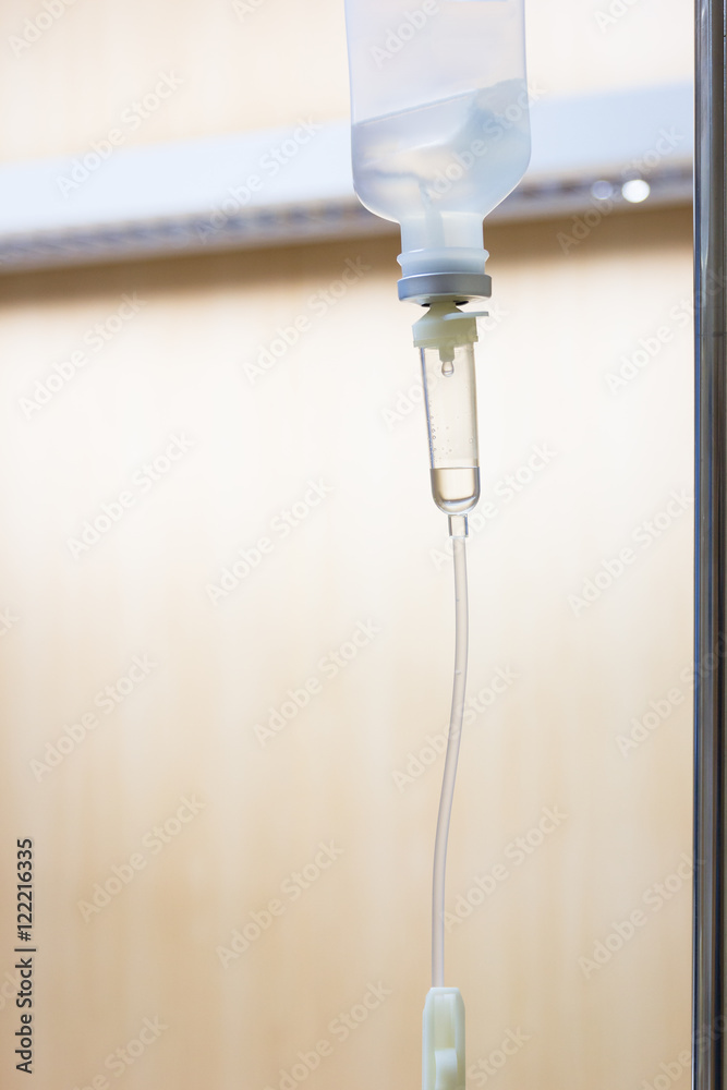 Close up saline solution drip for patient and infusion pump in h Close up saline solution drip for patient and infusion pump in h
