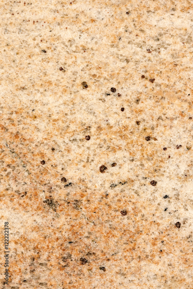 Brown stone with black spots, background, texture