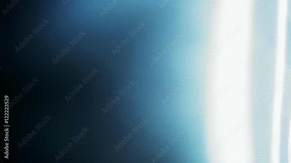 Abstract light hits a dark background.