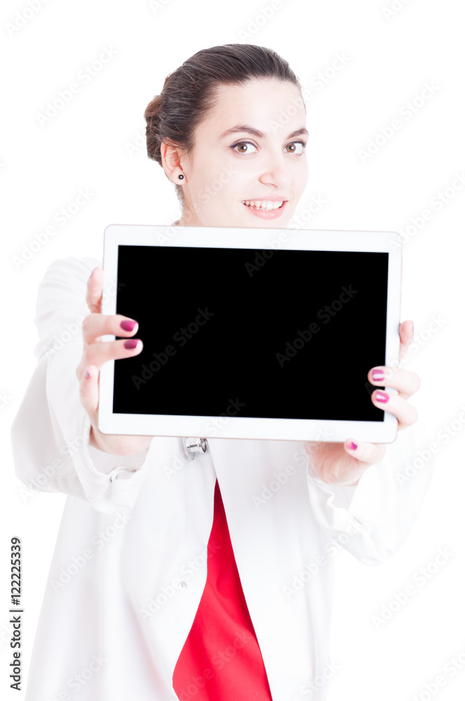 Smiling young doctor showing blank display of tablet Smiling young doctor showing blank display of tablet