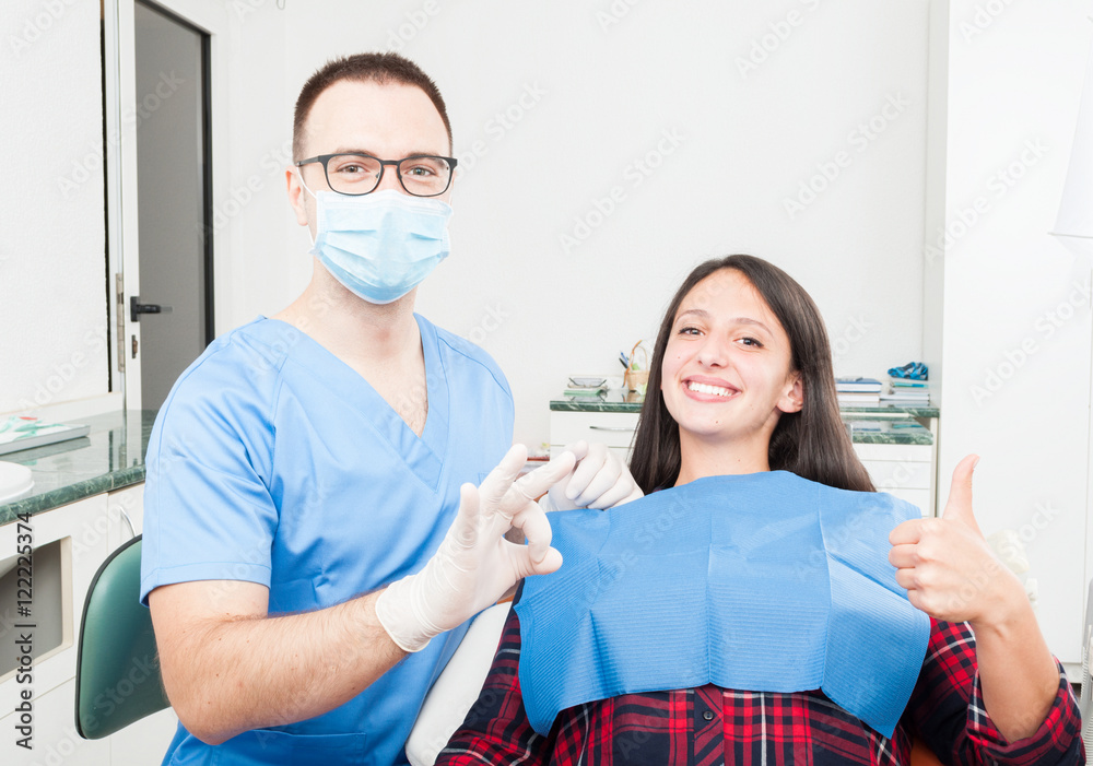 Fototapeta premium Patient and dentist showing thumb up and okay
