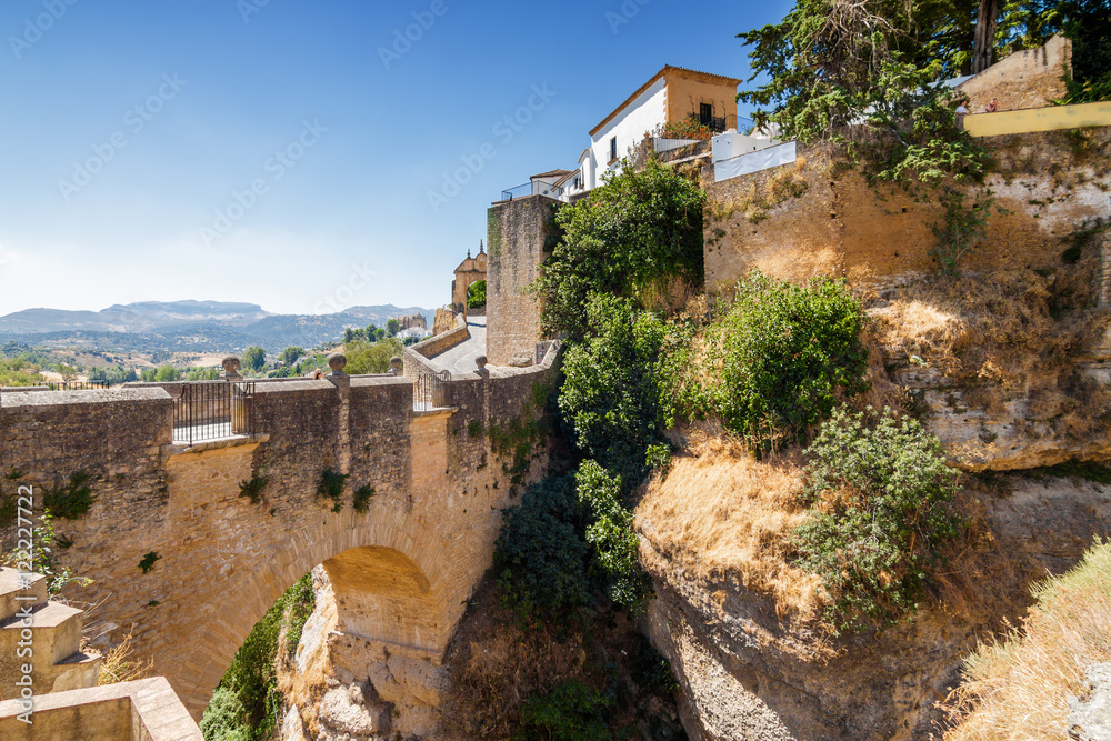 Buildings on the cliffside of El Tajo Gorge in Ronda, Malaga province, Spain.