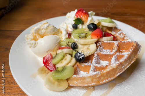 Mixed fruits waffle with ice cream