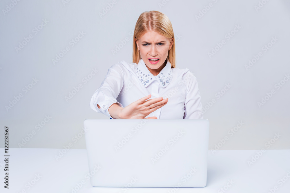Young businesswoman working at laptop computer. Young businesswoman working at laptop computer.