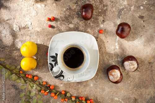Hot coffee and chestnuts, guince, rowan,. Autumn. Yellow, orange, brown, colorful photo