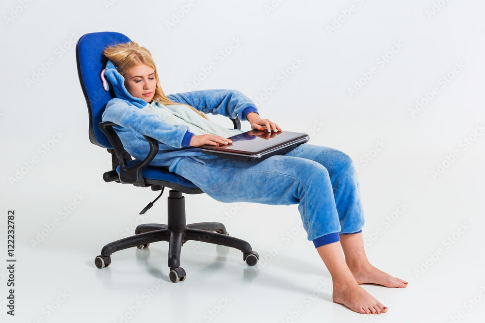 girl in pajamas with a laptop