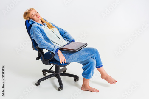 girl in pajamas with a laptop