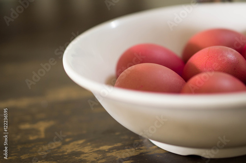 red eggs inside white bowl, Chinese baby full moon traditional concept