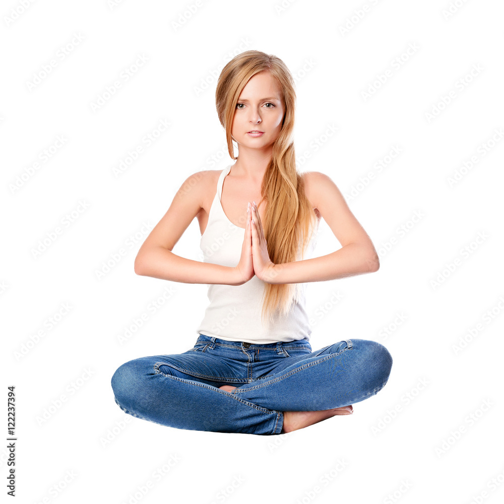 Portrait of young woman meditating in pose of lotus isolated on white. Long haired blonde girl doing yoga. Portrait of young woman meditating in pose of lotus isolated on white. Long haired blonde girl doing yoga.